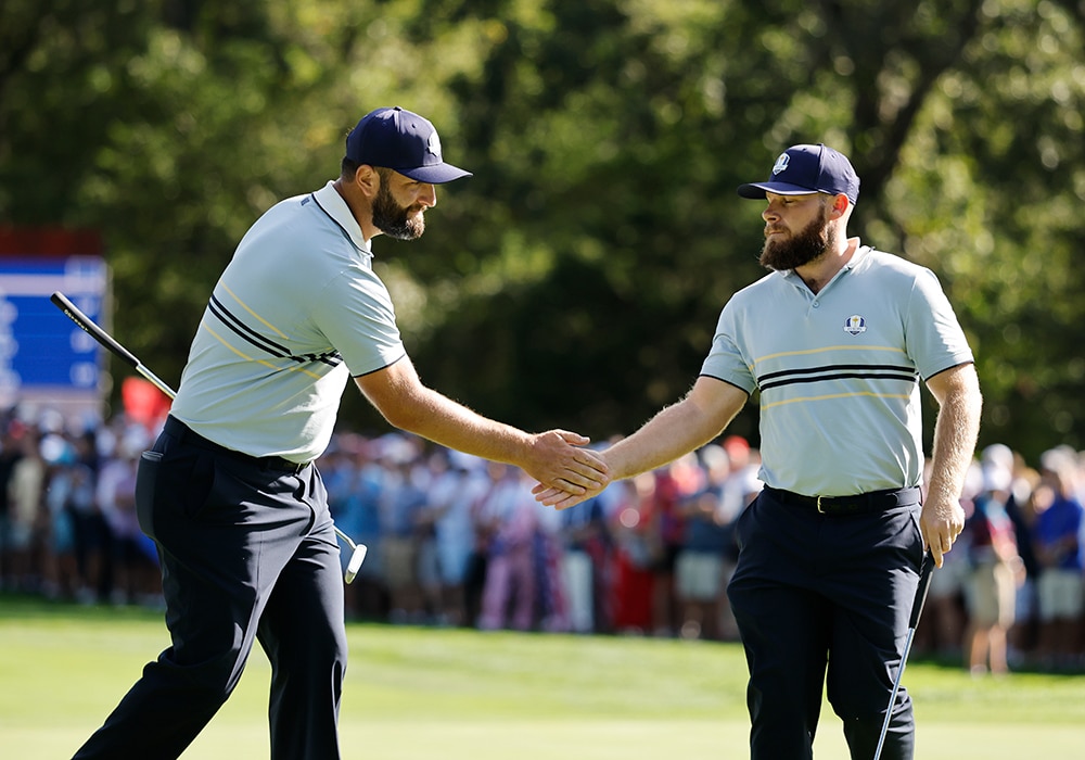 FARMINGDALE, NY - SEPTEMBER 26: Tyrrell Hatton and Jon Rahm of Team Europe high five on the 13th hole during the 2025 Ryder Cup on the Black Course at Bethpage State Park on Friday, September 26, 2025 in Farmingdale, New York. (Photo by Michael Reaves/PGA of America)
